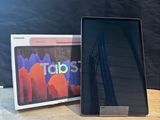 an image of a tablet computer sitting on top of a wooden table