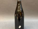 a bottle of wine that is sitting on a table