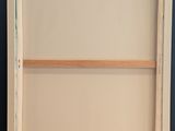an empty picture frame sitting on top of a wooden table