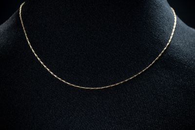 a gold chain necklace on a mannequin mannequin mannequin mannequin mannequin mannequin mannequin mannequin manne