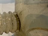 a close up of a bottle of water on a table