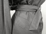 a black and white photo of a woman in a dress
