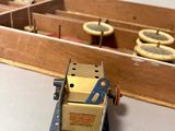 a toy robot that is sitting next to a wooden box