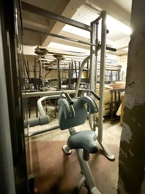 an image of a gym room with equipment in it