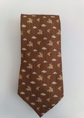 brown necktie with flying birds and clouds on a white background