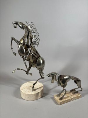 statue of a man on a horse and a dog on a marble base