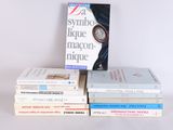 several books are stacked on top of each other on a table