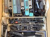 a box full of assorted toy trains in it