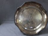 a silver plate that is sitting on a table