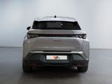 the rear end of a silver car in a white room