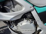 a close up of a motorcycle parked on the street