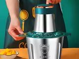 a woman that is making something with a blender