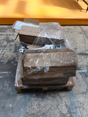 a pile of boxes sitting on the ground next to a building