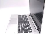 a laptop computer that is sitting on a white surface