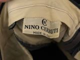 an image of a close up of a person ' s hand holding a label on a jacket