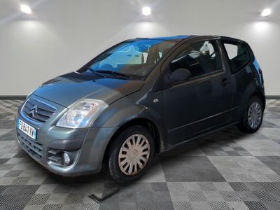 a picture of a small car parked in a garage