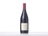 a bottle of wine that is sitting on a table