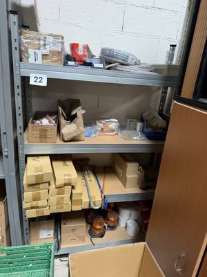 many boxes and boxes on the shelves in the room