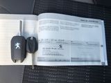 a car key and remote control on the back seat of a car