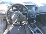the interior of a car with a steering wheel and dashboard controls