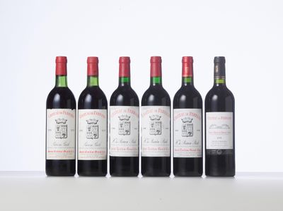 six bottles of red wine lined up in a row