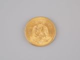 an image of a close up of a gold coin on a white surface