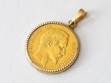 an image of a gold coin with a woman ' s face on it