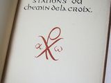 an open book with a picture of a pair of scissors on it