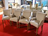 many chairs that are sitting in the middle of a room