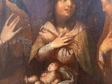 an image of a painting of a woman holding a baby in her arms