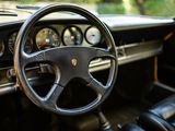 a steering wheel and dashboard of an old car
