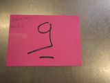 a pink post it note with a drawing of a face on it