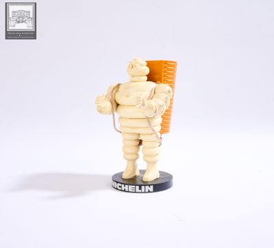 a statue of a man with a carrot in his hand