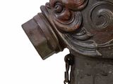 an old fire hydrant with a chain attached to it