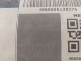 a close up of a barcode with a qr code on it
