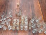 a lot of empty wine glasses on a wooden table