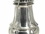 an antique silver salt shaker with a lid on a white background
