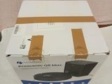 packaging of a box with a black speaker on top of it