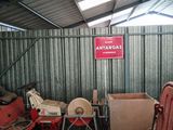 a garage with a lot of junk in it