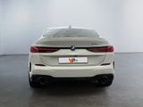 the rear end of a white bmw 6 series coupe