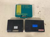 two floppy drives that are sitting next to each other