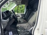 a white van with a black seat in the back of it
