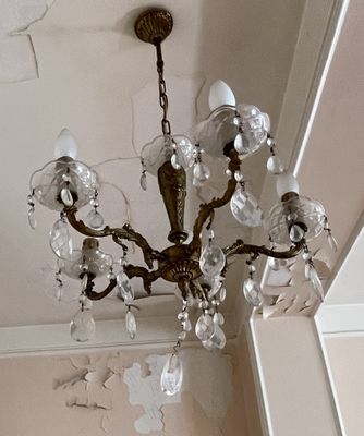 a chandelier hanging from the ceiling in a room
