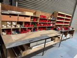 many shelves with red containers on them in a warehouse