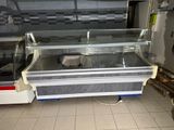 a glass display case in the middle of a kitchen
