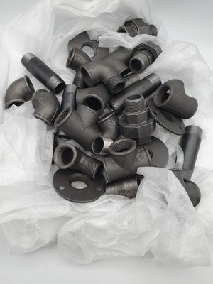 a lot of pipe fittings in a plastic bag