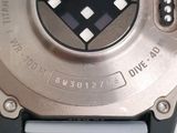 a close up of a silver watch with a black face