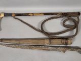 two different types of walking sticks and a cane on a white surface