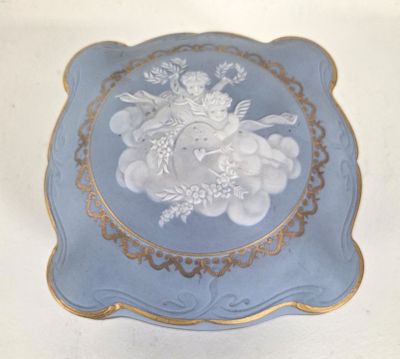 a blue plate with a picture of a woman on it