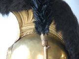 an image of a helmet with a feather on it